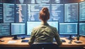 Developer monitors multiple screens displaying code in modern tech workspace, focused on programming tasks in front of large Royalty Free Stock Photo