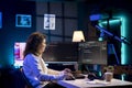 Developer in neon lit apartment implement security measures