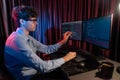 IT developer pointing online software information coding on pc screen. Gusher.