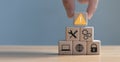 Developer programmer holding a wooden cube with warning triangle sign for notifying error found error and maintenance concept