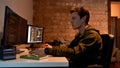 IT developer programming code for mining at home Royalty Free Stock Photo