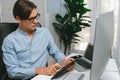 IT developer selecting by point on coding online software. Pecuniary. Royalty Free Stock Photo
