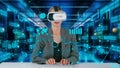 IT developer typing computer code for analyzing intelligent by VR. Contraption.