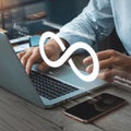Developer typing, glowing infinity symbol, surrounded by digital graphics, enhancing tech vibe