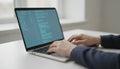 Developer working on laptop writing software code Royalty Free Stock Photo