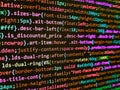 Developer working on software codes in office. HTML code on lcd screen. Computer program preview. Programmer working in a software Royalty Free Stock Photo