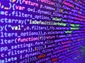 Developer working on software codes in office. Web server data on a monitor. Javascript code in bracket software. Digital Royalty Free Stock Photo