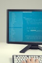 Developer working on source codes on computer at office