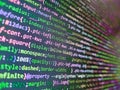 Developer working on web sites codes in office. Hi-tech modern screen of data, digits and chars on monitor. HTML markup language