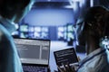 Data center specialists code on tablet