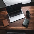 Developers Wooden Desk with Code on Screen Royalty Free Stock Photo