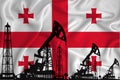 Developing Flag of Georgia. Silhouette of drilling rigs and oil rigs on a flag background. Oil and gas industry. The concept of