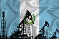 Developing Flag of Guatemala. Silhouette of drilling rigs and oil rigs on a flag background. Oil and gas industry. The concept of