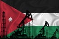 Developing Flag of Jordan. Silhouette of drilling rigs and oil rigs on a flag background. Oil and gas industry. The concept of oil