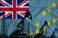 Developing Flag of Tuvalu. Silhouette of drilling rigs and oil rigs on a flag background. Oil and gas industry. The concept of oil