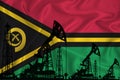 Developing Flag of vanuatu. Silhouette of drilling rigs and oil rigs on a flag background. Oil and gas industry. The concept of