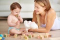 Developing her motor skills and hand-eye coordination. an adorable baby girl and her mother playing with wooden blocks Royalty Free Stock Photo