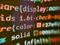 Developing HTML and technology. Black background with colored lines of code. Information technology website coding standards for Royalty Free Stock Photo