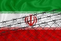 Developing Iran Flag, mesh fence and barbed wire. Concept of isolation of emigrants. With place for your text