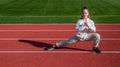 Developing physical fitness. Teenage girl stand in lunge position. Physical educaiton. Sports school