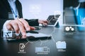 businessman working with smart phone and digital tablet and laptop computer in modern office with glass reflected view Royalty Free Stock Photo