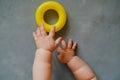 Developing toys, early baby development concept. Baby hand playing with plastic toy. Royalty Free Stock Photo