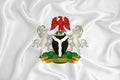 A developing white flag with the coat of arms of Nigeria. Country symbol. Illustration. Original and simple coat of arms in