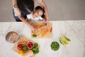 Development, child and mother in kitchen, vegetables and learn cooking together being happy, smile and safety. Top view Royalty Free Stock Photo