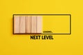 Development, improvement. Completing a task and moving forward to the next level. Next level loading bar on yellow background Royalty Free Stock Photo