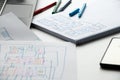 Development and sketches on paper of a custom mobile application on the desktop, graphic design Royalty Free Stock Photo