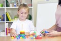 Developmental and speech therapy classes with a child-girl.