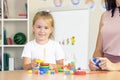 Developmental and speech therapy classes with a child-girl.