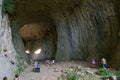 Devetashka cave in Bulgaria and visitors. Royalty Free Stock Photo