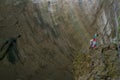 Devetashka cave in Bulgaria and visitors. Royalty Free Stock Photo