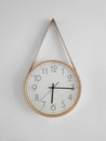 deviant classic clock hanging on a white wall Royalty Free Stock Photo