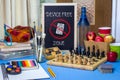 Device Free Zone chalk board on table with games, art materials, books and chess board Royalty Free Stock Photo