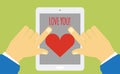Device with heart on the screen holding in hands Royalty Free Stock Photo