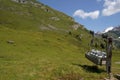 Device for transport of milk canisters with pulley. Agricultural technology on pastures in Alp mountains of high altitude.