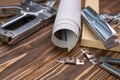 Devices for stretching canvas on a wooden frame. Stapler, canvas roll, wood frame and tensioning tongs