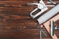 Devices for stretching canvas on a wooden frame. Stapler, canvas roll, wood frame and tensioning tongs. Topview