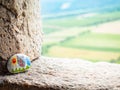 The picture painted on a stone is part of a children`s tourist game