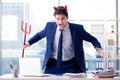 The devil angry businessman in the office Royalty Free Stock Photo
