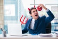 The devil angry businessman in the office Royalty Free Stock Photo