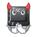 Devil esc button attached to cartoon keyboard Royalty Free Stock Photo