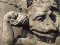 Devil face, detail of sculpture Saint Procopius of Sazava, Bohemian canon and hermit, baroque statue in the open