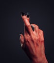 Devil hand with gesture cross fingers Royalty Free Stock Photo