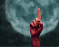 Devil hand pointing upward Royalty Free Stock Photo