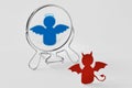 Devil looking in the mirror and seeing himself as an angel - Good and evil, distorted self-image concept Royalty Free Stock Photo