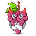 Devil red grapes fruit above mascot table