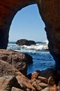 Devil`s Punchbowl cave looking out into Pacific Ocean waves